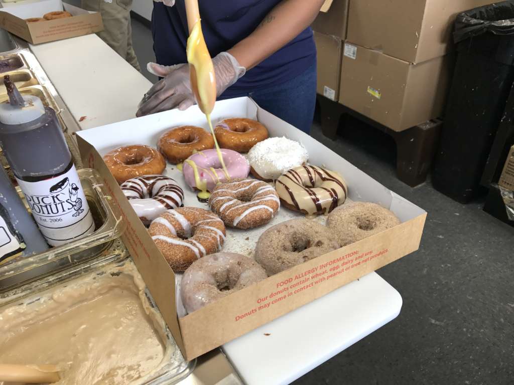 Duck Donuts serves Vanilla cake-based donuts that are fried on the spot and topped with a variety of glazes, icings and candies. Visitors can customize their doughnuts with a choice of 12 different “coatings,” six different “toppings” and four different “drizzles.”